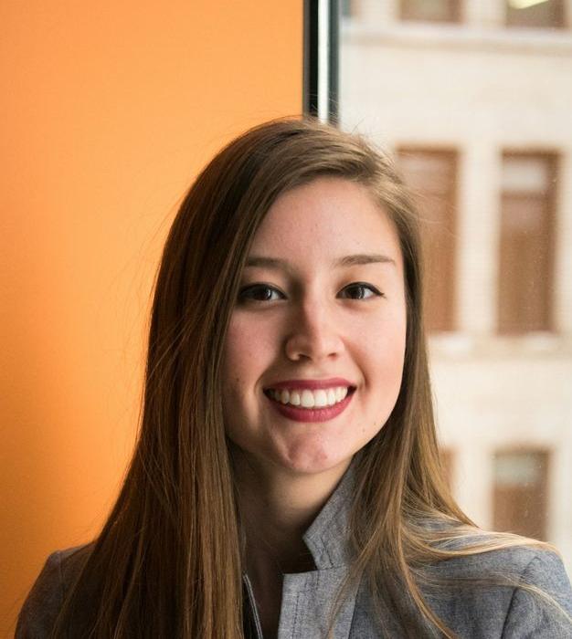 shallow focus photo of woman in gray jacket